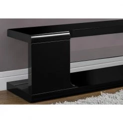 Jasmine 16 in. Black and Clear Particle Board TV Stand Fits TVs Up to 55 in. with Glass Shelves by HomeRoots -HomeRoots Sales black clear homeroots tv stands 333256 c3 1000